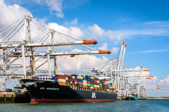 Le Havre, France - June 8, 2021: APL Minnesota container ship is docked in Port 2000 container terminal, being unloaded with super post-panamax container gantry cranes.
