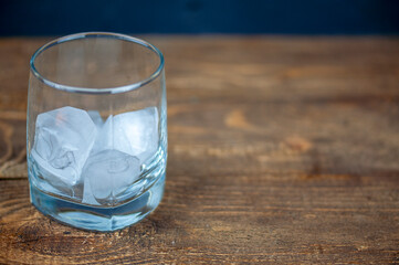 bottle of whiskey with a glass