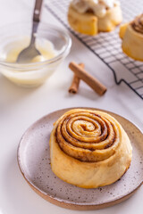 Sweet homemade cinnamon roll, bun with cinnamon powder