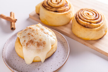 Sweet homemade cinnamon roll, bun with cinnamon powder
