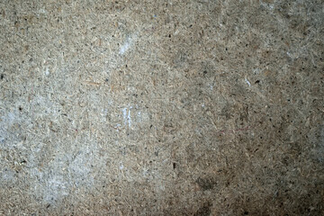 a plate of pressed wood sawdust, close-up, as a texture for the background