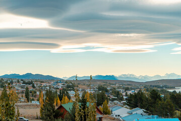 Town of Calafate, Santa Cruz, Argentina.  Typical clouds of patagonia - obrazy, fototapety, plakaty