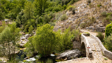 Sant Angelo in Fasanella (Italy). View of the medieval stone humpback bridge over the sources of...