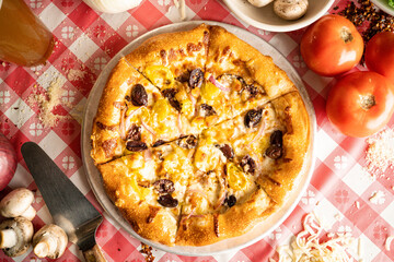 pizza with olives and pepperoncini overhead