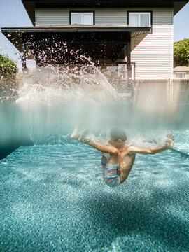 Split view of a 7 years old boy jumping in a pool at home