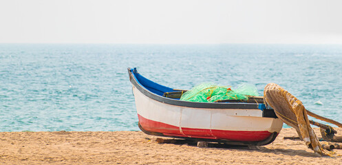 boat parked on the beach in Goa, India