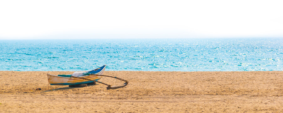 rowboat parked on the beach alone in Goa, India