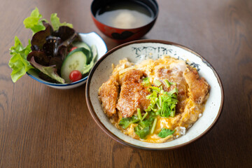 Katsudon, breaded deep-fried pork with egg topping on rice, japanese style food