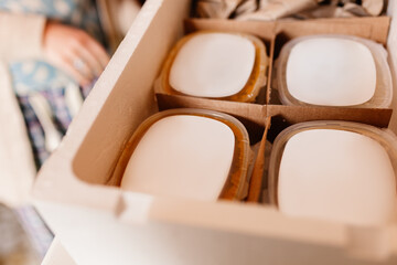 Woman checking deliver box with precooked food
