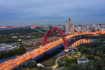 Fototapeta na wymiar Panoramic view of Moscow on a summer evening, Russia. Picturesque region in the north-west of Moscow city. Zhivopisny bridge across the Moscow river.