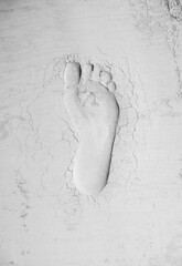 Human footprint in cement. Labor day and hard work idea. Minimal abstract civilization progress concept. Copy space.