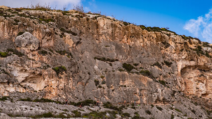 Find a climber on top of cliff