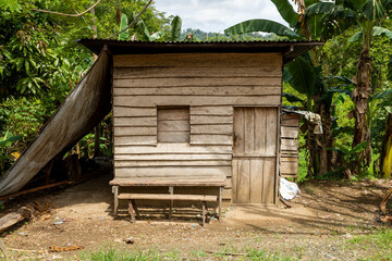A humble and lonely little house, built of wood, in the middle of a banana plantation, near the town of Waisai, Raja Ampat, Indonesia