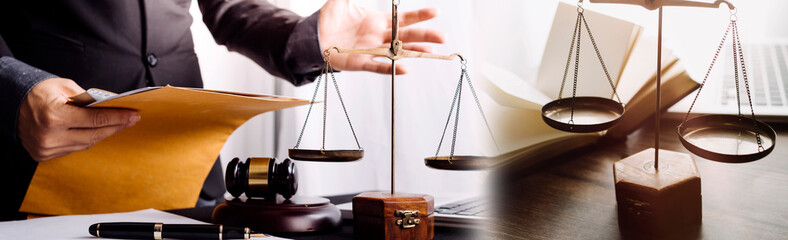 justice and law concept.Male judge in a courtroom on wooden table and Counselor or Male lawyer...