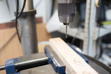 Drilling machine with laser sight in the workshop