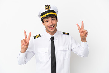 Airplane pilot over isolated white background showing victory sign with both hands