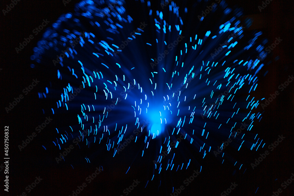 Wall mural blue abstract particles and lines with bokeh and blur in dark background.