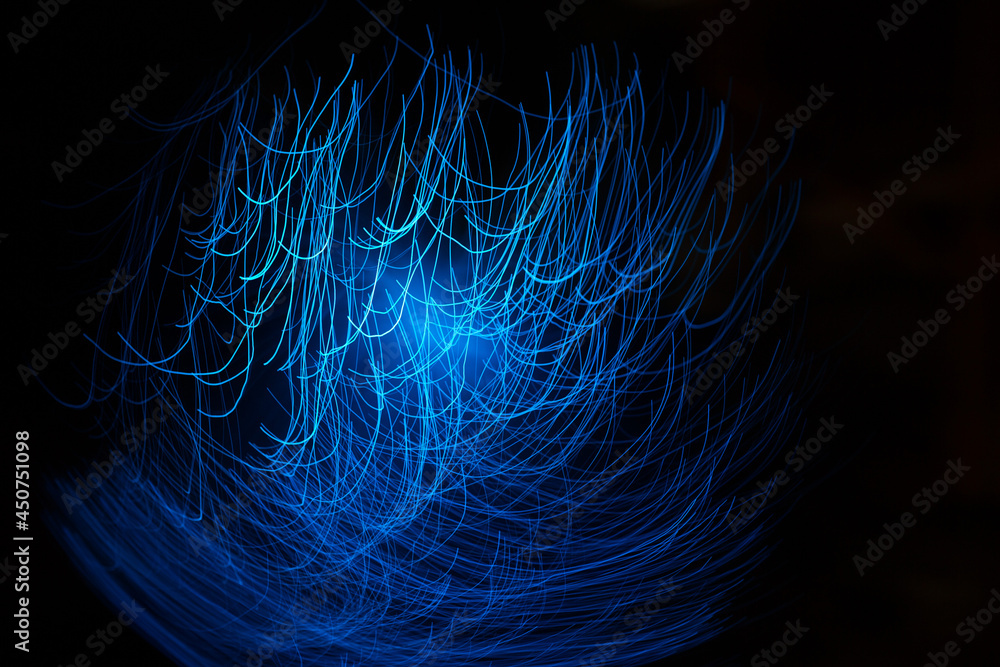 Wall mural blue abstract particles and lines with bokeh and blur in dark background.
