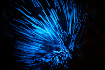 Fototapeta premium Blue abstract particles and lines with bokeh and blur in dark background.