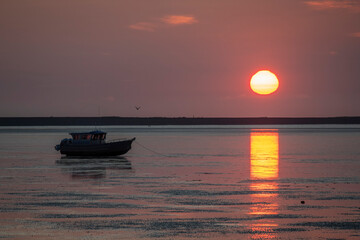 Boat on Cook Inlet Tide Flats at Low Tide, Sunrise