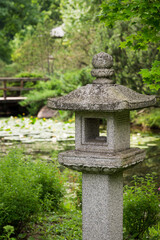 Close-up of a stone lantern in japanese garden.