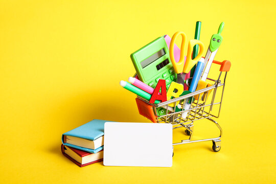 Credit Card, Empty Blank, Stationery, Shopping Basket On Yellow Background. Education, Back To School, Shopping.