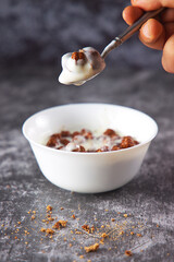 Chocolate cereal with koumis and spoon