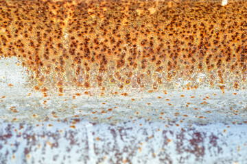 Background of peeling paint and rusty old meta. Little black dots and scratches. Corrosion of metal, abstract background, texture for the photo, the result of a careless attitude to metal