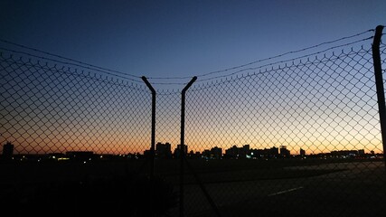 sunset in the city - fence