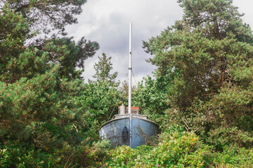 Old abandoned fishing ship in the forest
