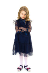 Cute little serious girl posing with arms crossed