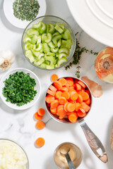 Ingredients for a homemade casserole with carrots and celery and onions