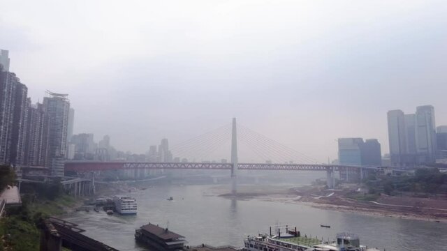 Low water level on Yangtze river in Chongqing. Crossing with Jialing river during drought conditions. Dry riverbeds in major Chinese city.
