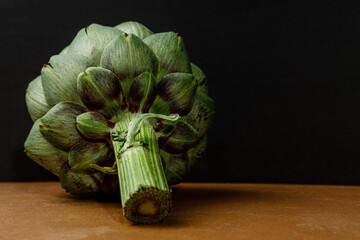 artichoke on black background