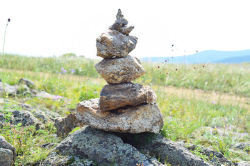 Fototapeta na wymiar Rock balancing as a shamanism religion symbol in Olkhon island, Russia