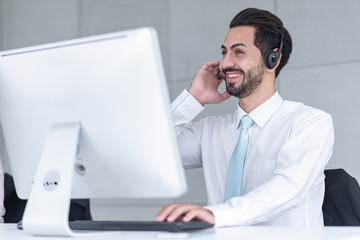 business man wear working receiving call wear headphone consulting or solving problems for customers,Employees wearing headphones doing telemarketing