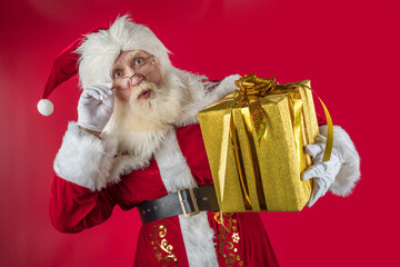 Emotional senior male model old man with a natural white beard in the role of Father Christmas