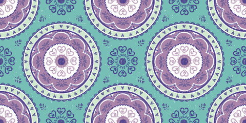 Seamless vector pattern of a brightly colored mandala. Great for teens, tweens, young women's fashion and fun.