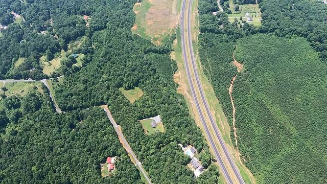 Bird eye view of highway 64 exit and roads amidst green landscape, Asheboro, North Carolina, USA