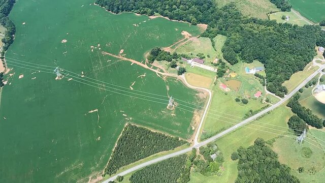 Bird eye view of power lines crossing agricultural field, North Carolina, USA