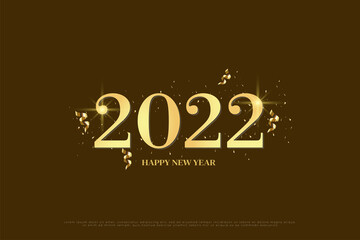 Fototapeta na wymiar happy new year 2022 on brown background with gold glitter and gold ribbon.