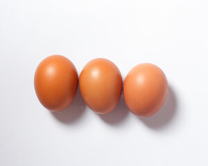 Eggs isolated on a bright background. Front photo. Egg wallpapers. Design, visual arts, minimalism. Egg templates. Organic chicken egg concept. Healthy organic food and diet concept. Focus blur.