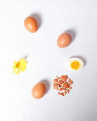 Naklejka na ściany i meble Eggs isolated on a bright background. Front photo. Egg wallpapers. Design, visual arts, minimalism. Egg templates. Organic chicken egg concept. Healthy organic food and diet concept. Focus blur.