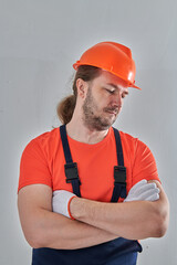 chic portrait of a builder on a wall background