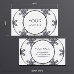 Business cards are white with luxurious black patterns. Business card design with monogram ornament.