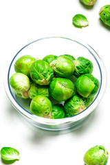 fresh green brussels sprouts on white background