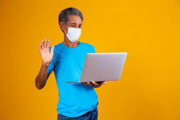 elderly man making a computer video call with family members in the pandemic. Quarantine concept
