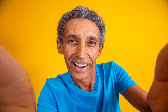 Close Up Of Older Man Taking A Selfie.