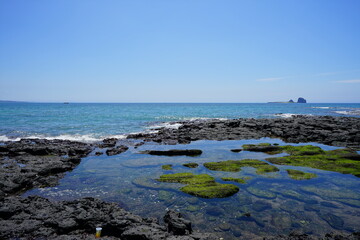 a beautiful seascape with a distant island