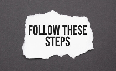 Follow these steps sign on the torn paper on the black background
